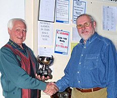 Patrick (right) receives one of many club prizes.