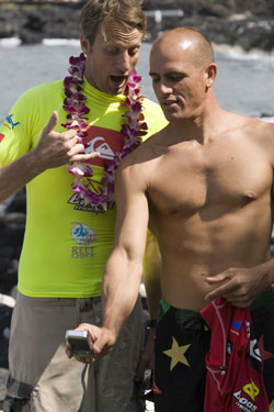 Pro surfer Kelly Slater and skateboarder Tony Hawk check out the PENTAX Optio W10 during the recent Kelly Slater Invitational in Kona, Hawaii